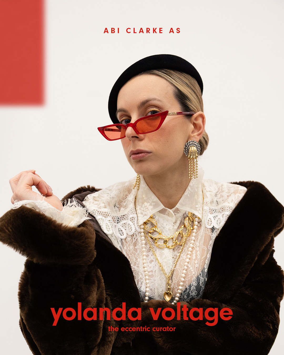 Fashion-focused creator portrait featuring Yolanda Voltage in bold styling and red sunglasses for the Argos Arghaüs campaign.